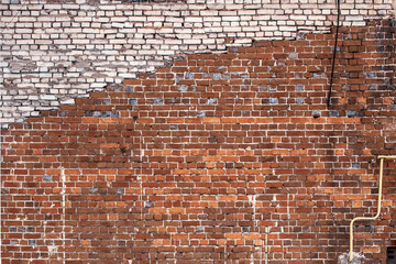 A wall of old red brick. Texture, background.