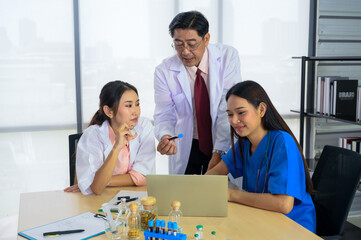 Team of Asian doctors and nurse have a meeting in medical meeting room. Happy meeting in hospital.