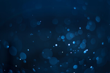 abstract sparkle bokeh light effect with navy blue background