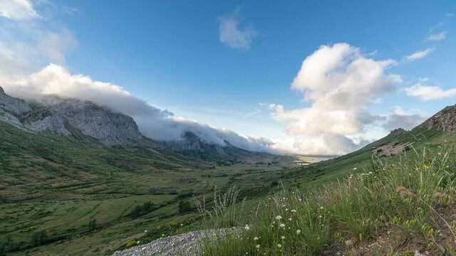 Time lapse with clouds passing through the mountain peaks in the Arbas Valley in Leon, Spain	
