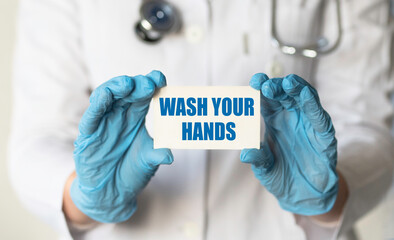 DOCTOR hold card with a text WASH YOUR HAND.