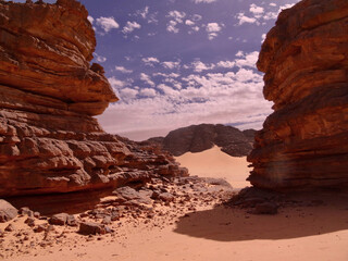 landscape of sands surrounded by rocks
