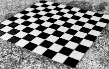 Fototapeta premium Black and white ceramic tiles in checkerboard pattern