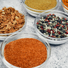 Spices and spices in glass saucers. Cooking and kitchen.