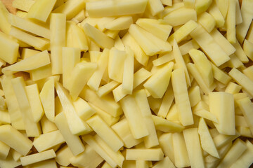 Freshly sliced rectangular pieces of potato, close-up. cooking potatoes.