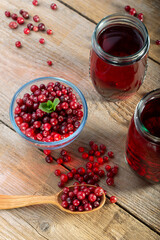 Cranberry drink and fresh berries on the table