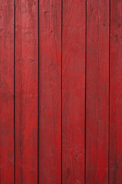 Vertical texture of red painted wooden boards