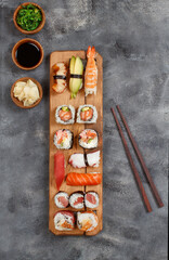 Sushi Set nigiri and sushi rolls on a wooden tray