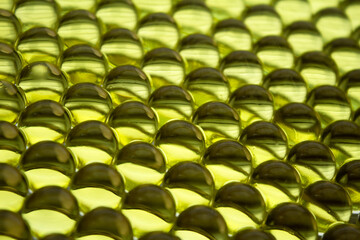 Macro of gold gel balls. Abstract geometric hydrogel background