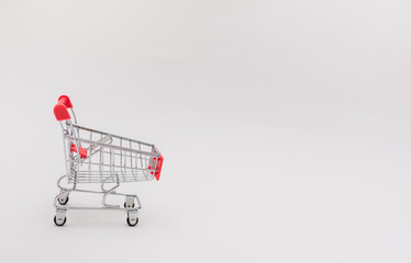 empty metal trolley on a white isolated background with space for text.