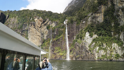 Naklejka premium Steep mountain cliffs in Milford Sound Fiordland National Park, New Zealand.
