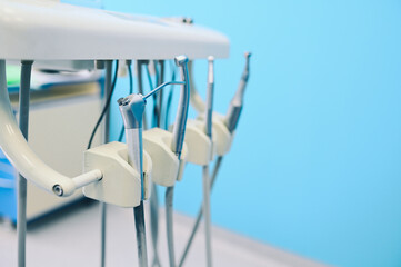 Different professional dental equipment, instruments and tools in a dentists stomatology office clinic.