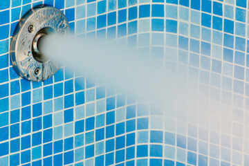 It sees a powerful water flow from the nozzle in the basin