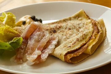 Gravlax with pancake served salad