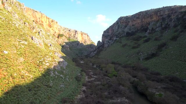 Flying backwards revealing a beautiful canyon, drone footage 4k