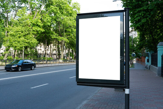 Empty White Citylight Near The Road And Park. Blank Vertical Billboard On The Street During Summer, Blank Template .