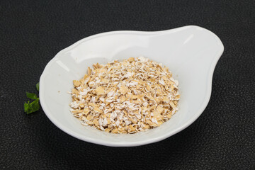 Raw oats in the bowl