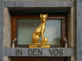 House of the Little Fox. Fox sculpture to the house In den Vos, facade decoration, Baroque style....
