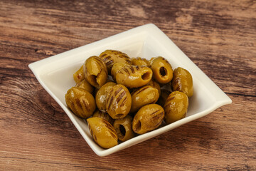 Green grilled olives in the bowl