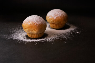 Bakery bread with flour on black background. 