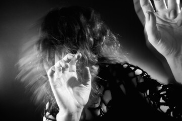 Woman nightmare. Supernatural force. Terrified insane lady hiding from paranormal energy on dark...