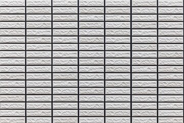 Modern pattern of white stone block wall tile texture and seamless background