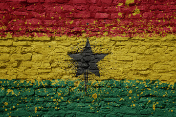 painted big national flag of ghana on a massive old brick wall