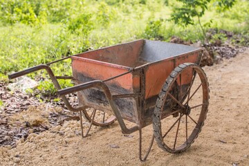 Fototapeta na wymiar old retro vintage wheelbarrow