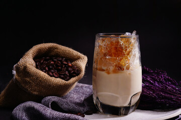 Ice coffee milk in the tall grass.  Cold Latte homemade beverage.  