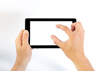 Middle aged man holding tablet computer in one hand and pinching to zoom tablet's screen on white...