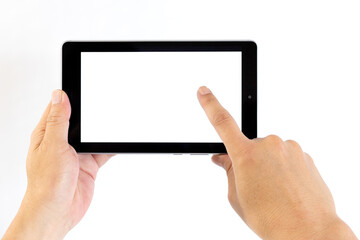 Close up on the hand of a middle aged man using technological devices like tablet, tapping the screen.