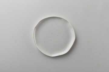 Top view shot of a rectangular white plate on white background.