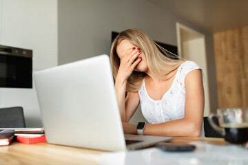 Online learning, work at home. Woman in depression at home office.