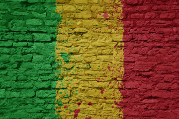 painted big national flag of mali on a massive old brick wall