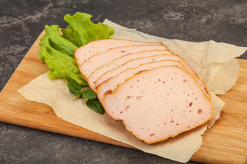 Boiled pork sausage over board