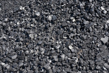 Pile of natural coal. Coal storage facility, top view.