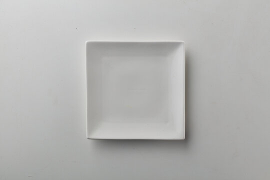 Top view shot of a squarish plate on white background.