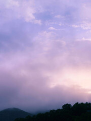 Naklejka premium Dramatic heaven in morning during rain. Soft light among clouds.