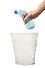 basket with a garbage bag. hand dips a plastic bottle into the bin. The concept of recycling,...