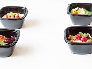 Healthy breakfast delivery. Fitness food. Eat right concept, healthy food, clean food take away in boxes, fried egg and vegetables, oatmeal, granola, cheesecakes