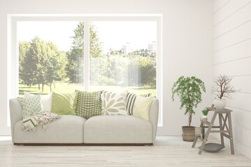 White living room with sofa and summer landscape in window. Scandinavian interior design. 3D illustration