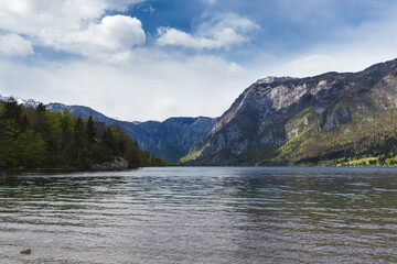 Fototapeta na wymiar Glacial lake Bohinj Slovenia clear water mountains sky largest