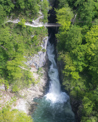 Škocjan caves Slovenia Reka river water stream waterfall green spring foliage