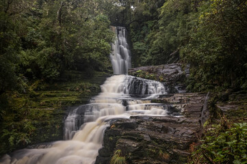 Fototapeta na wymiar Long exposure of McLean Falls, deep in the countryside of Southern New Zealand. 