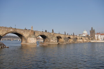 Obraz premium The romantic Vltava river, the beautiful Charlies Bridge and other historic buildings in Prague, Czech Republic