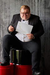 fat businessman with analysis chart showing current position on oil industry, depressed man in...