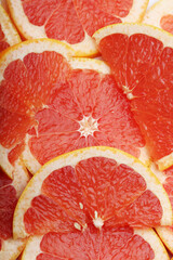 Background formed with sliced grapefruits