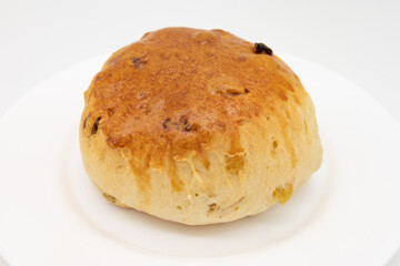 Large Tea Biscuit on a White Plate with a White Background