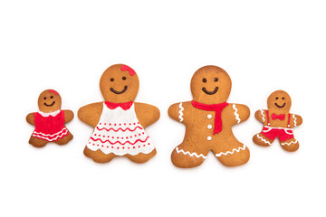 four christmas gingerbread men like a family isolated on white background.
