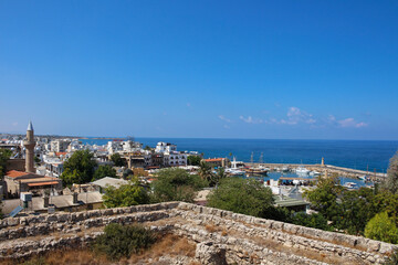  View from the fortress of Kyrenia on the Harbor, mosque with minaret, houses and the sea. Kyrenia. Cyprus.